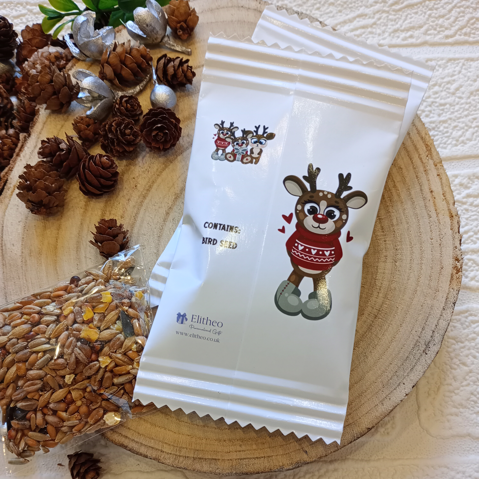 Personalised reindeer food packets containing bird seed.