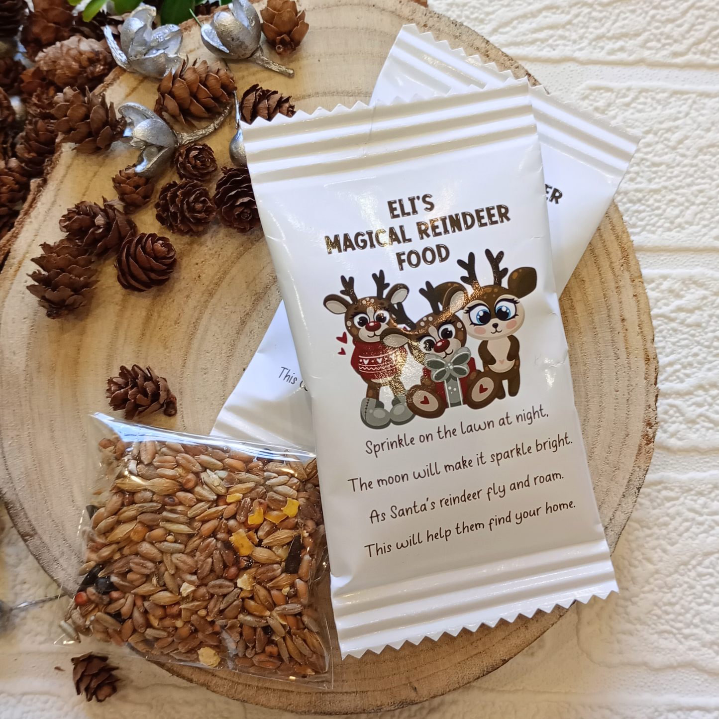 Personalised reindeer food packets containing bird seed.