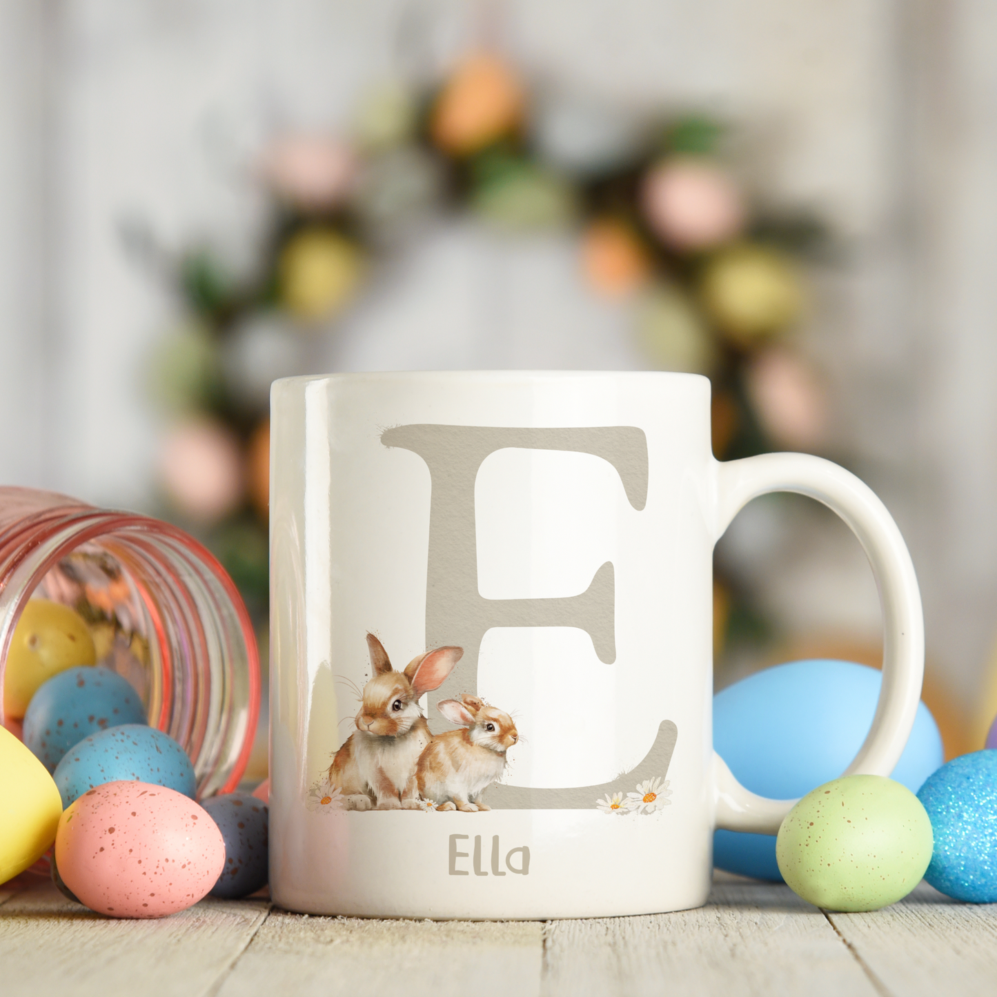 Ceramic mug featuring an alphabet personalised design with a cute bunny rabbit, letter E