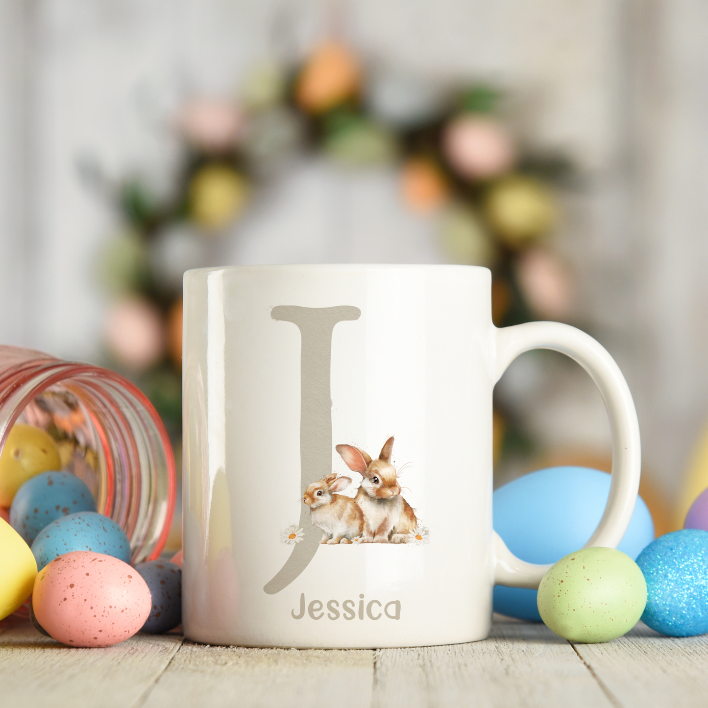 Ceramic mug featuring an alphabet personalised design with a cute bunny rabbit, letter J