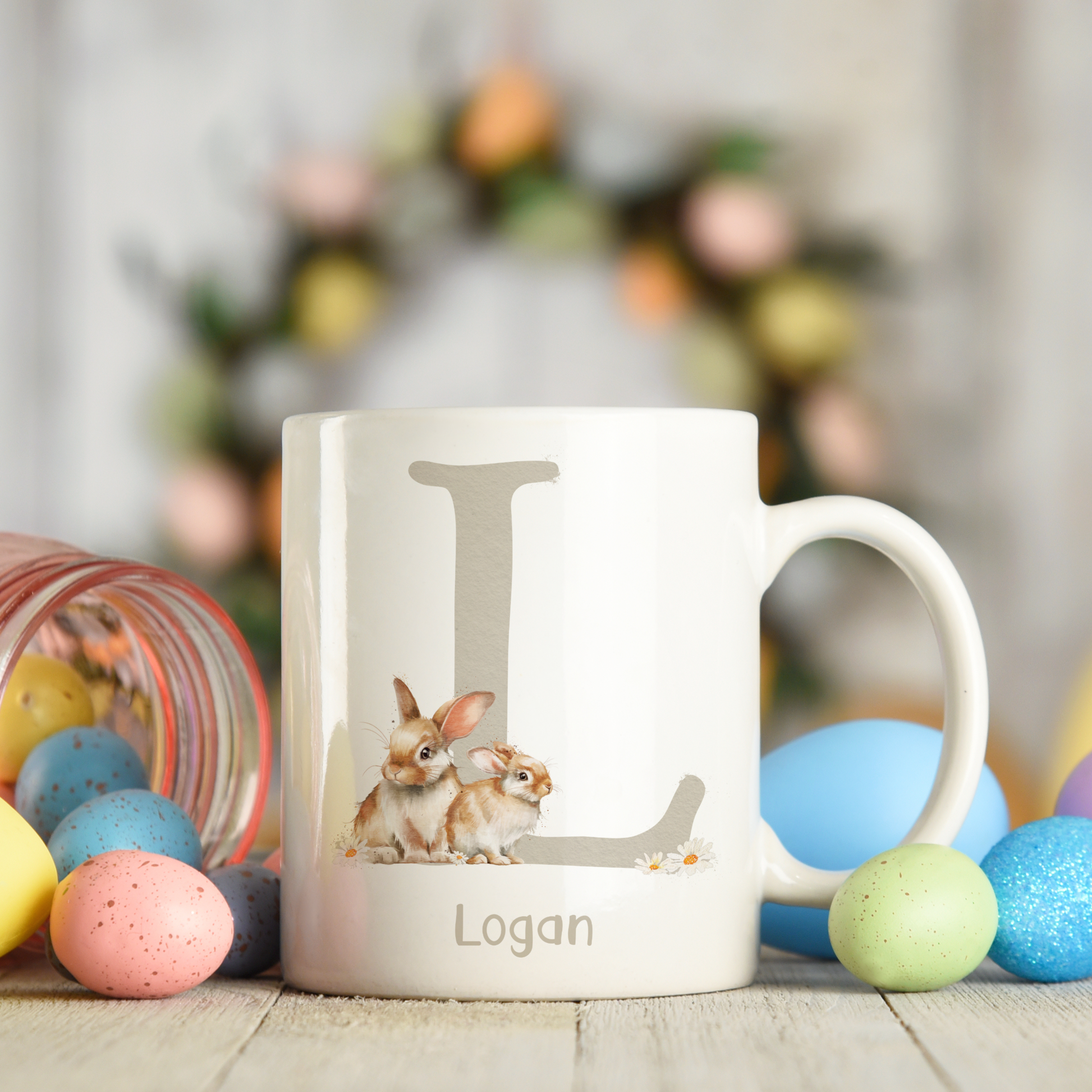 Ceramic mug featuring an alphabet personalised design with a cute bunny rabbit, letter L