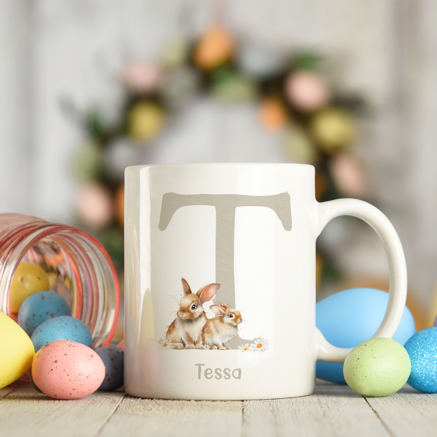 Ceramic mug featuring an alphabet personalised design with a cute bunny rabbit, letter T