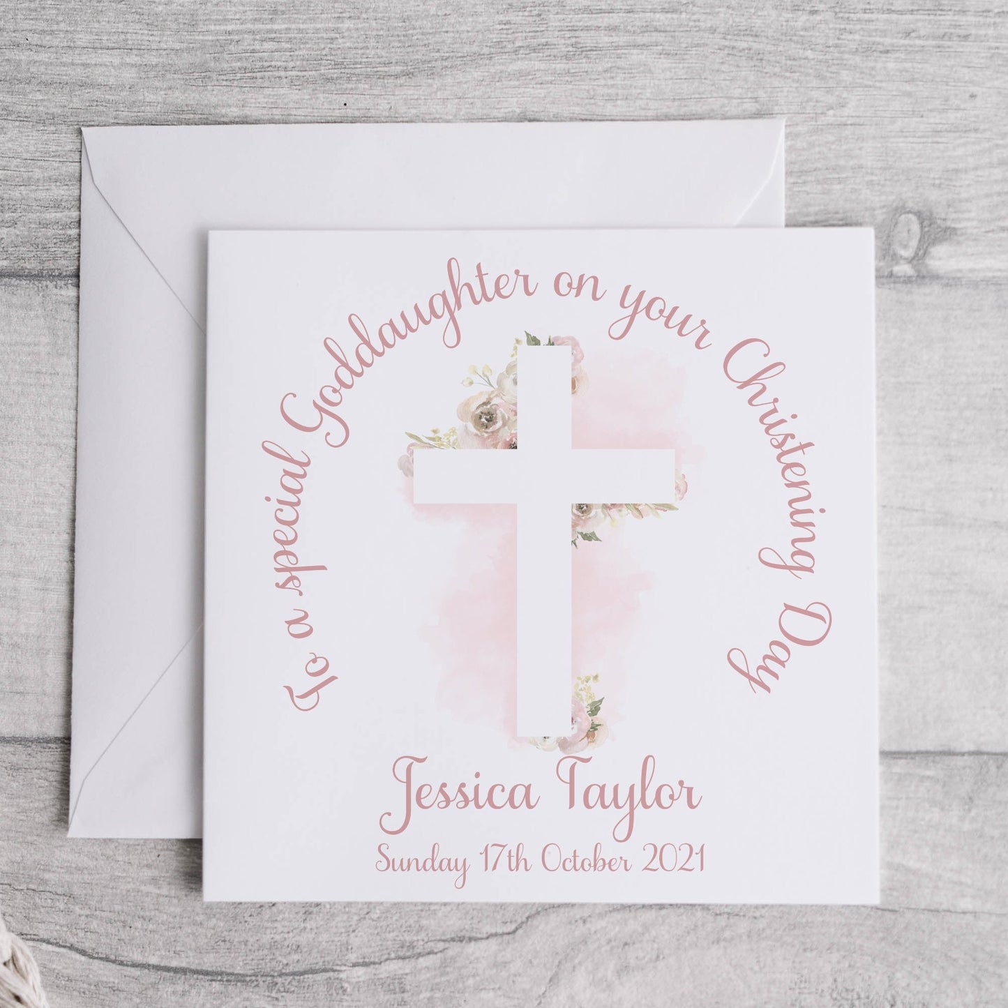 Personalised goddaughter christening card with the image of a floral cross with wording