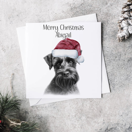 Personalised Christmas card featuring the sketch of a schnauzer wearing a Christmas hat