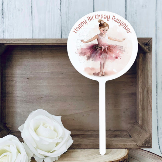 Acrylic round cake topper with the image of a ballerina girl dancing and is personalised