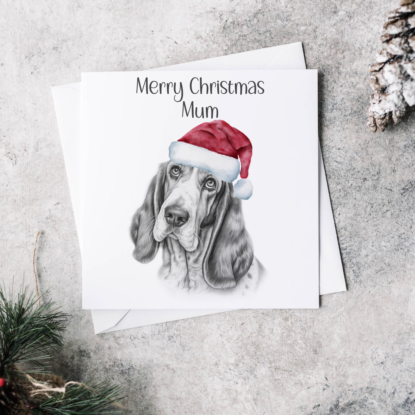 Personalised Christmas card with the image of a basset dog wearing a Christmas hat.