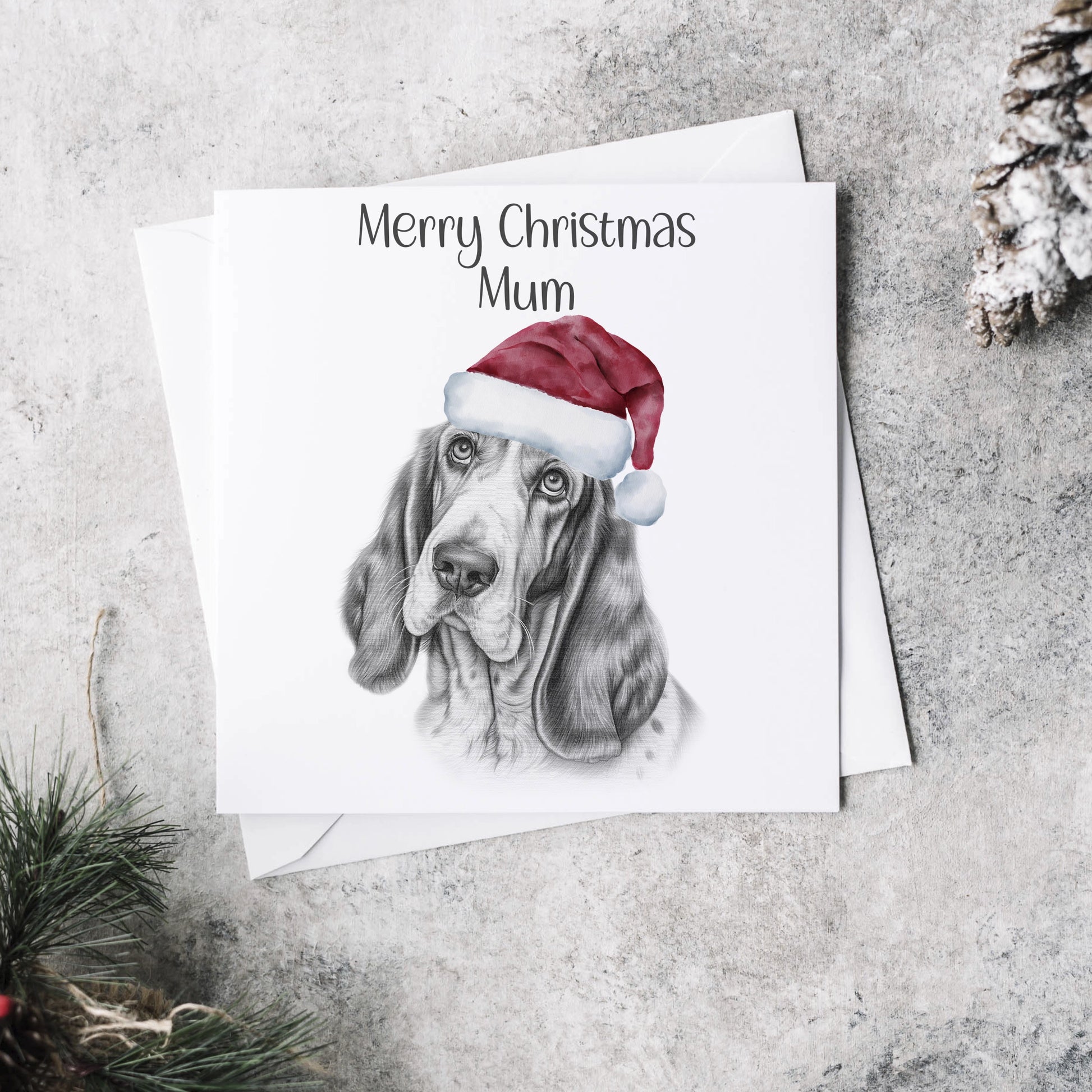 Personalised Christmas card featuring the sketch of a Basset dog wearing a Christmas hat