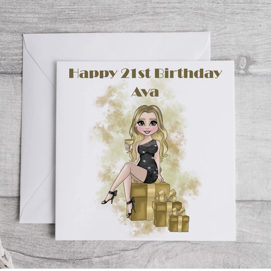 Printed personalised card featuring a girl in a cocktail dress holding a drink and sitting on gift boxes, in black and gold.