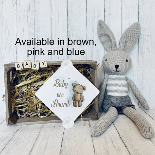 Brown teddy bear baby on board sign, first image explaining that there are three colours available.