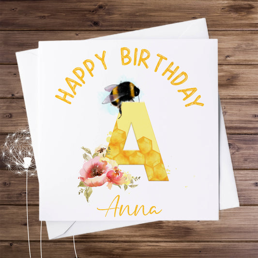 Personalised birthday card with a bumble bee, flowers and the initial letter A