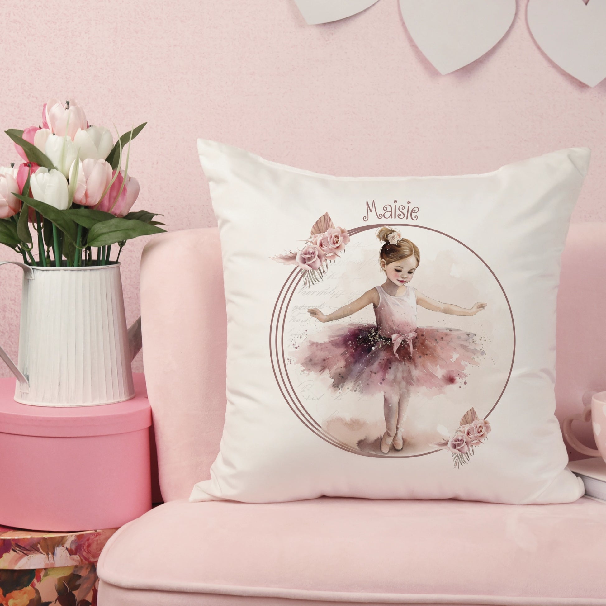 Cushion with a picture of a dancing ballerina in a burgundy tutu with a floral wreath and personalised with the name Maisie