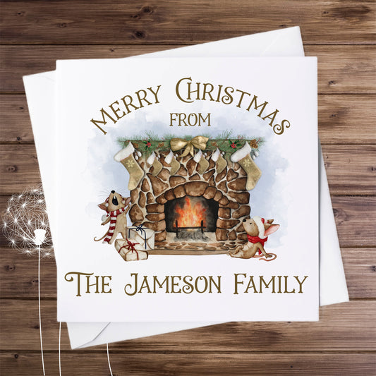 Merry Christmas card, personalised featuring a fireplace with gold stockings hanging on the mantelpiece