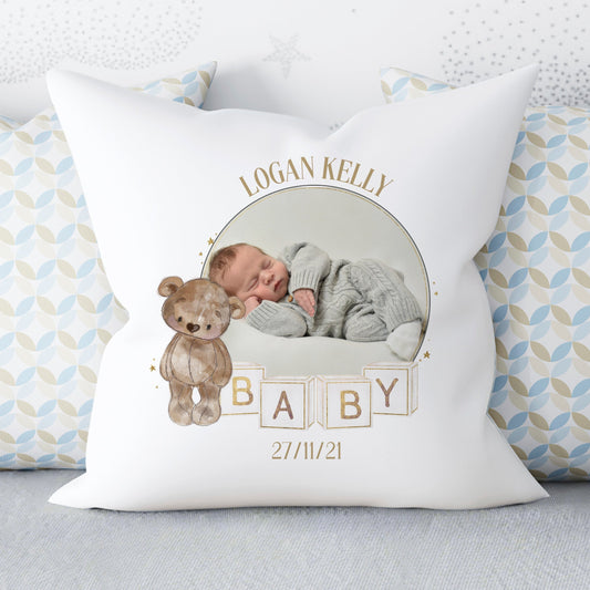 Cushion with a photo of a baby in the middle of a design of a brown bear and baby building blocks, personalised with name and date of birth