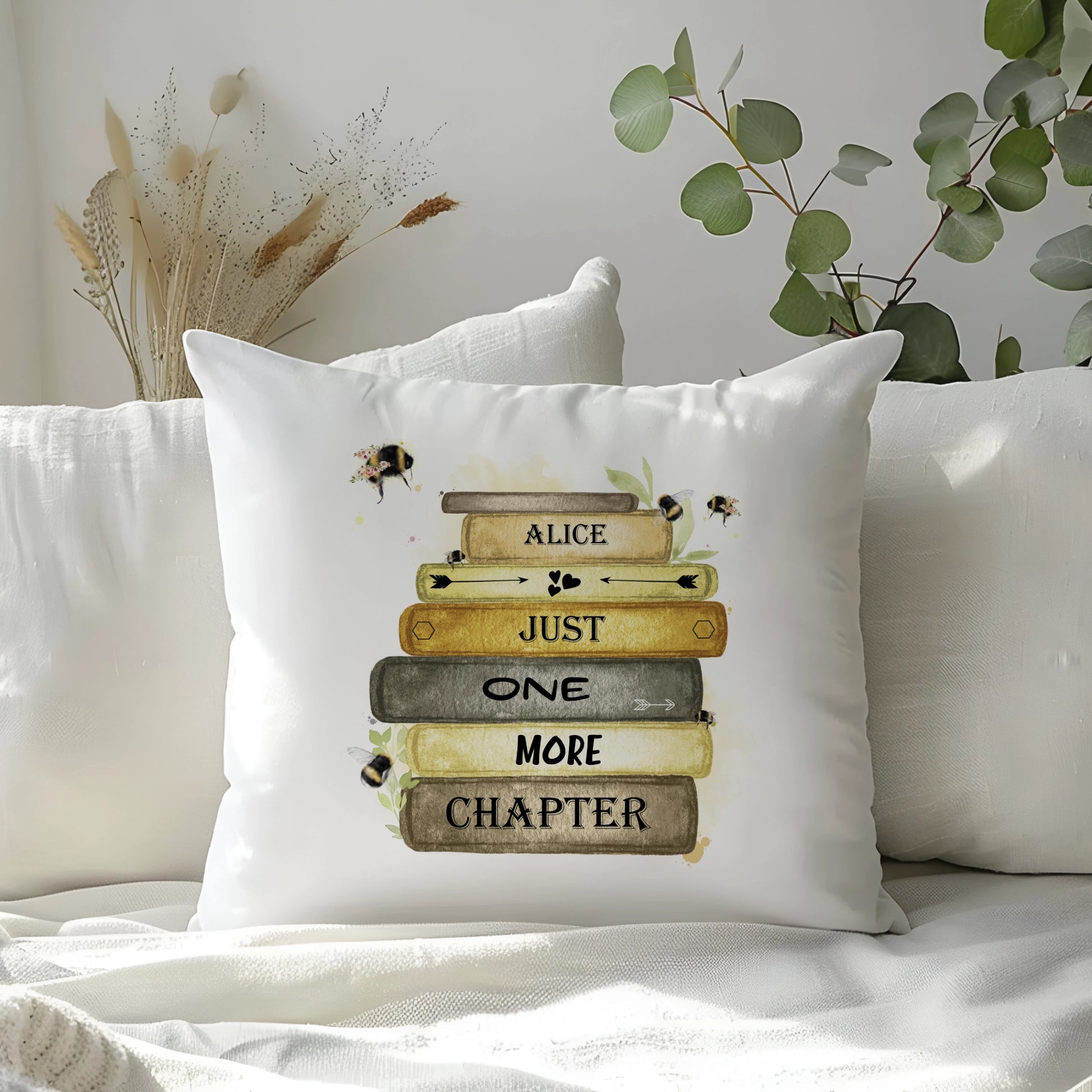 bumble bee book stack design personalised cushion with the quote 'just one more chapter'