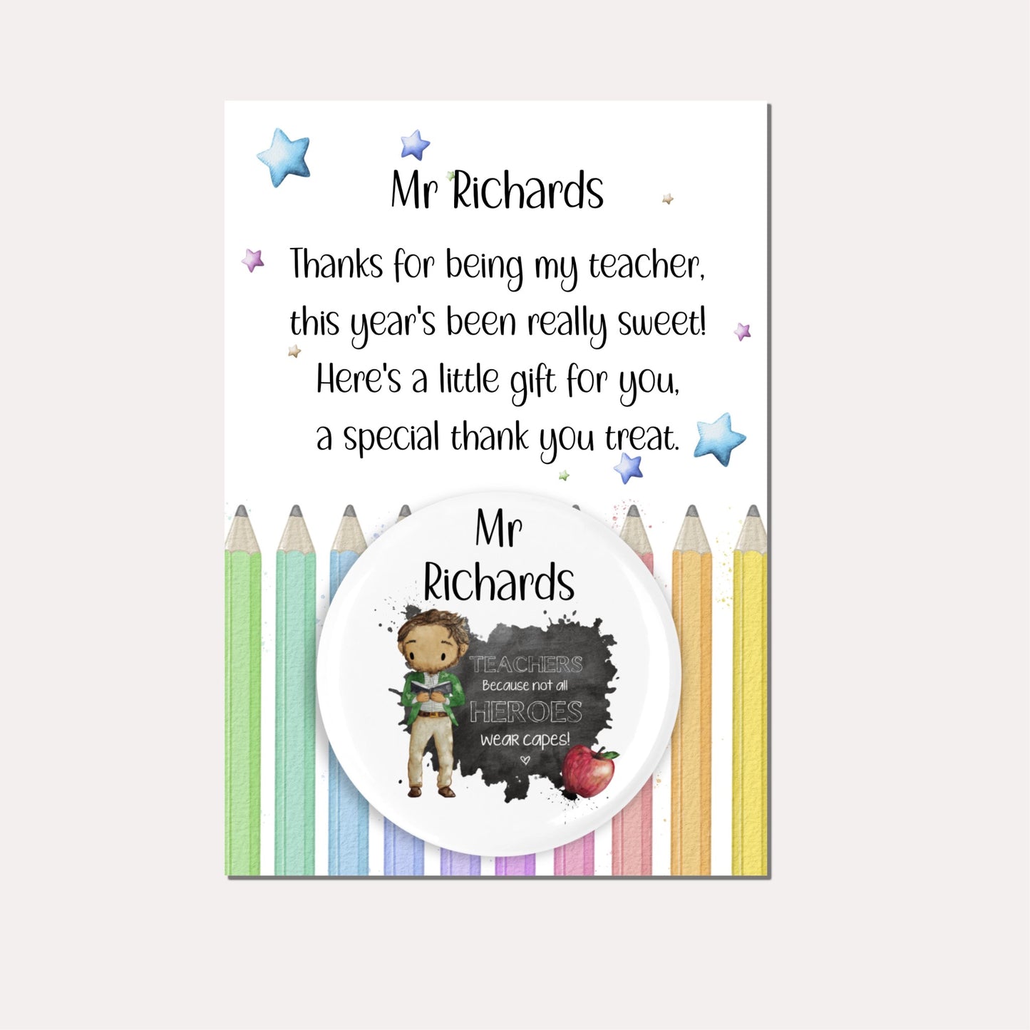 Personalised badge featuring a male teacher and an apple with the quote 'Teachers because not all heroes wear capes!' on a backing card with a pencil design and a poem.