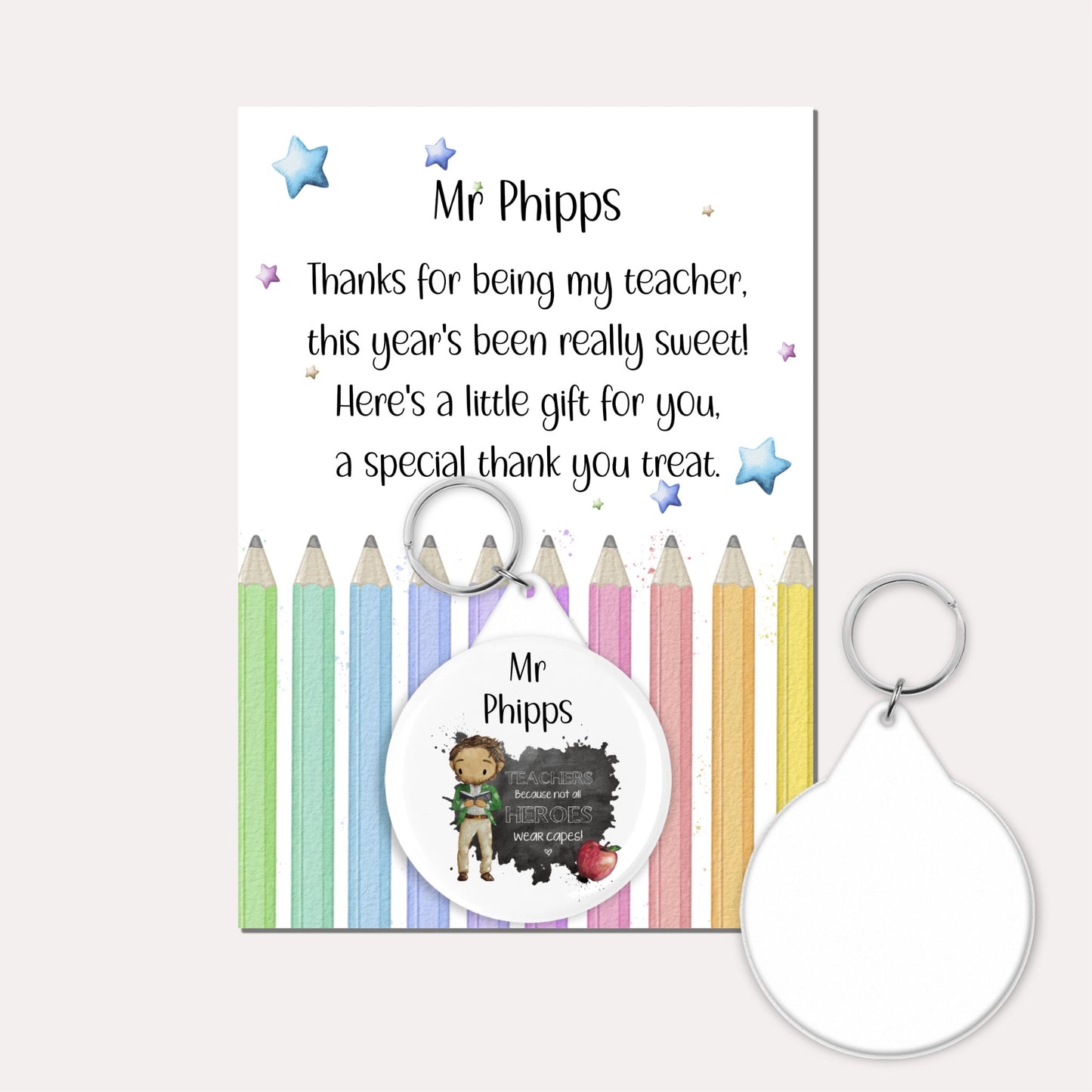 Personalised badge keyring featuring a male teacher and an apple with the quote 'Teachers because not all heroes wear capes!' on a backing card with a pencil design and a poem.