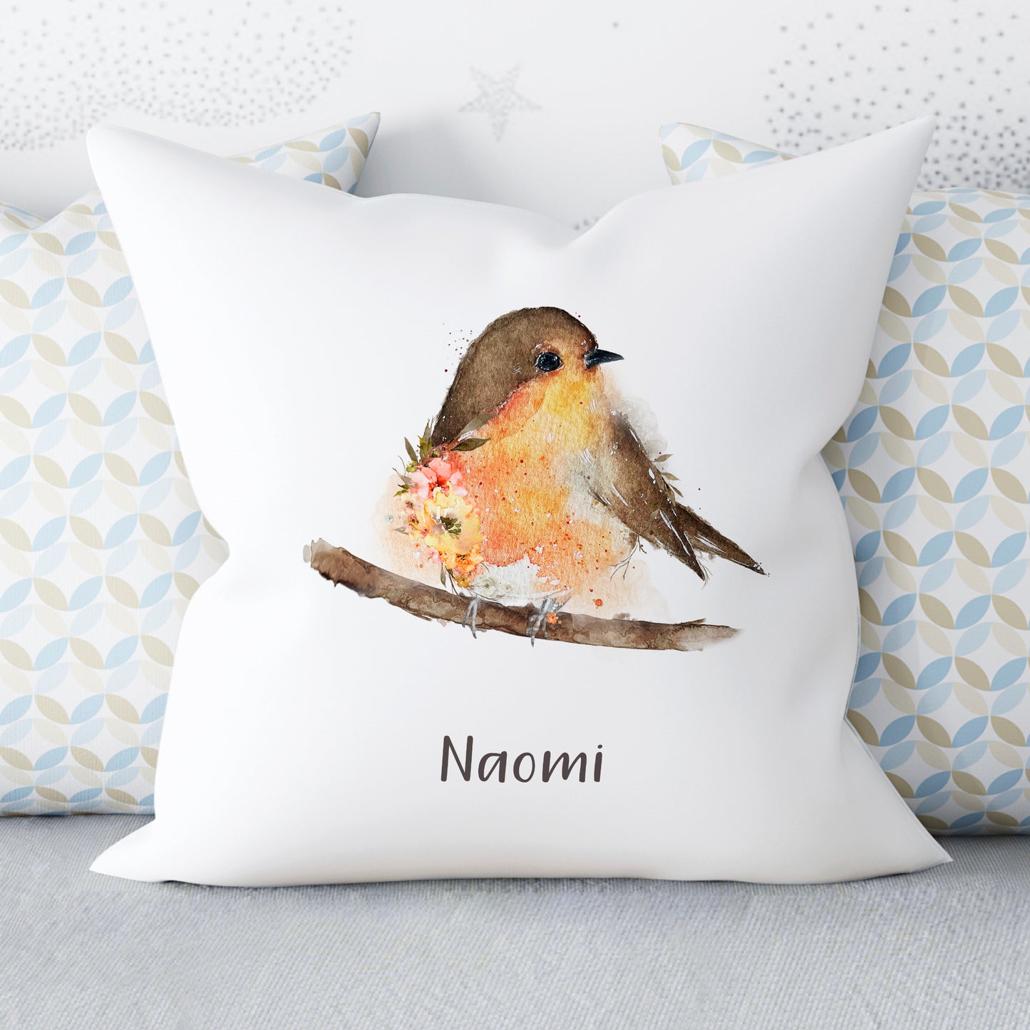 cushion with single robin sitting on a branch and personalised