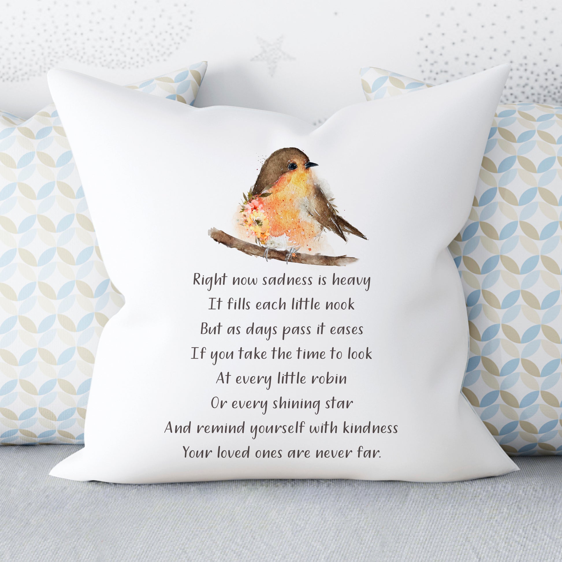 cushion with single robin sitting on a branch with a memorial poem printed underneath
