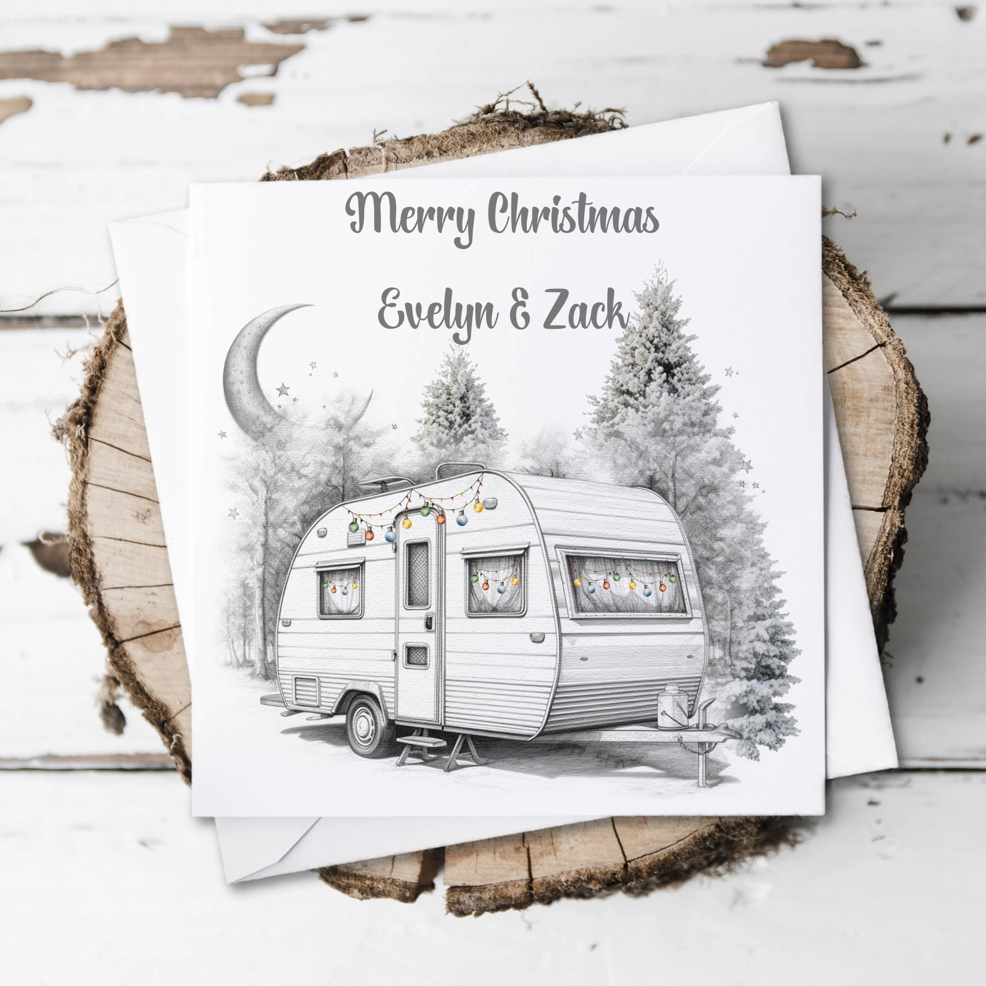 Personalised Christmas card featuring a caravan decorated with baubles and the text Merry Christmas 