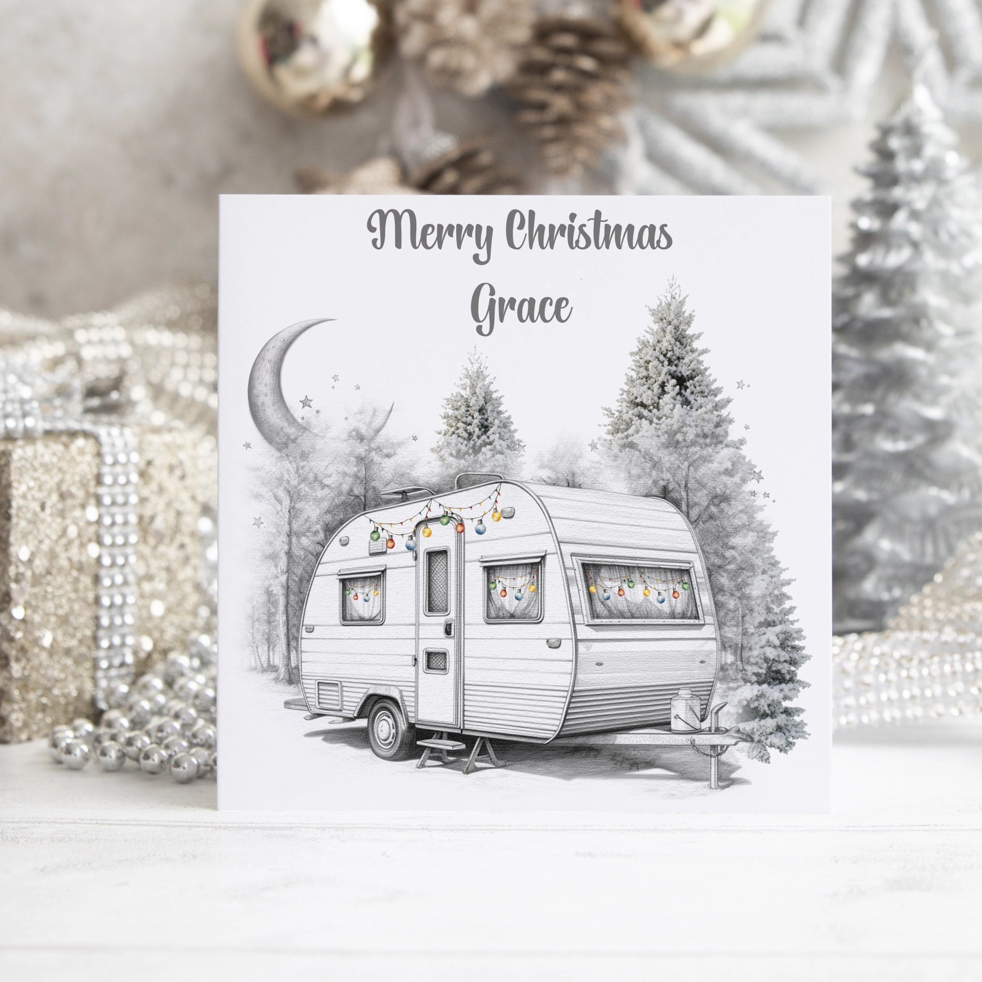 Personalised Christmas card featuring a caravan decorated with baubles and the text Merry Christmas 