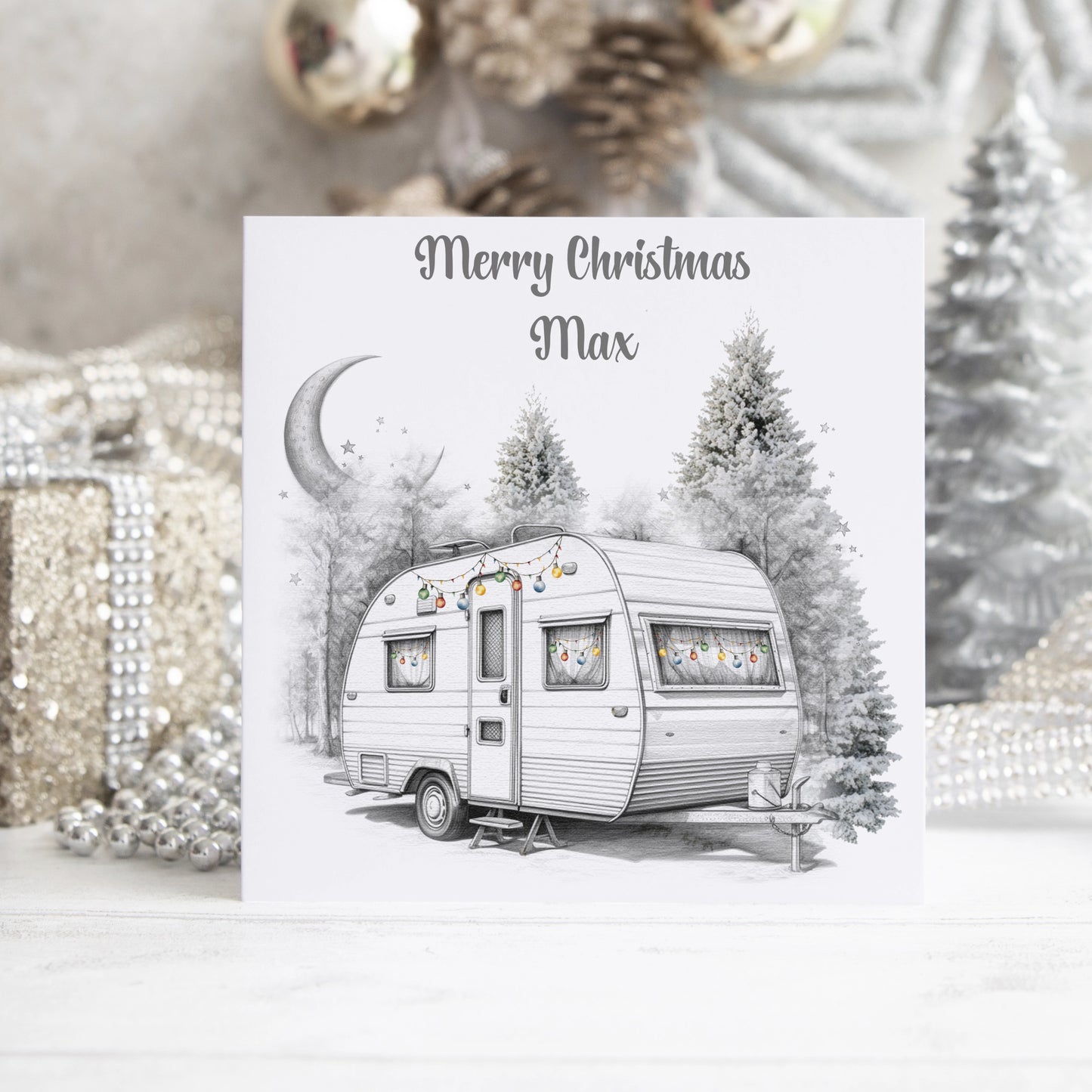 Personalised Christmas card featuring a caravan decorated with baubles and the text Merry Christmas 