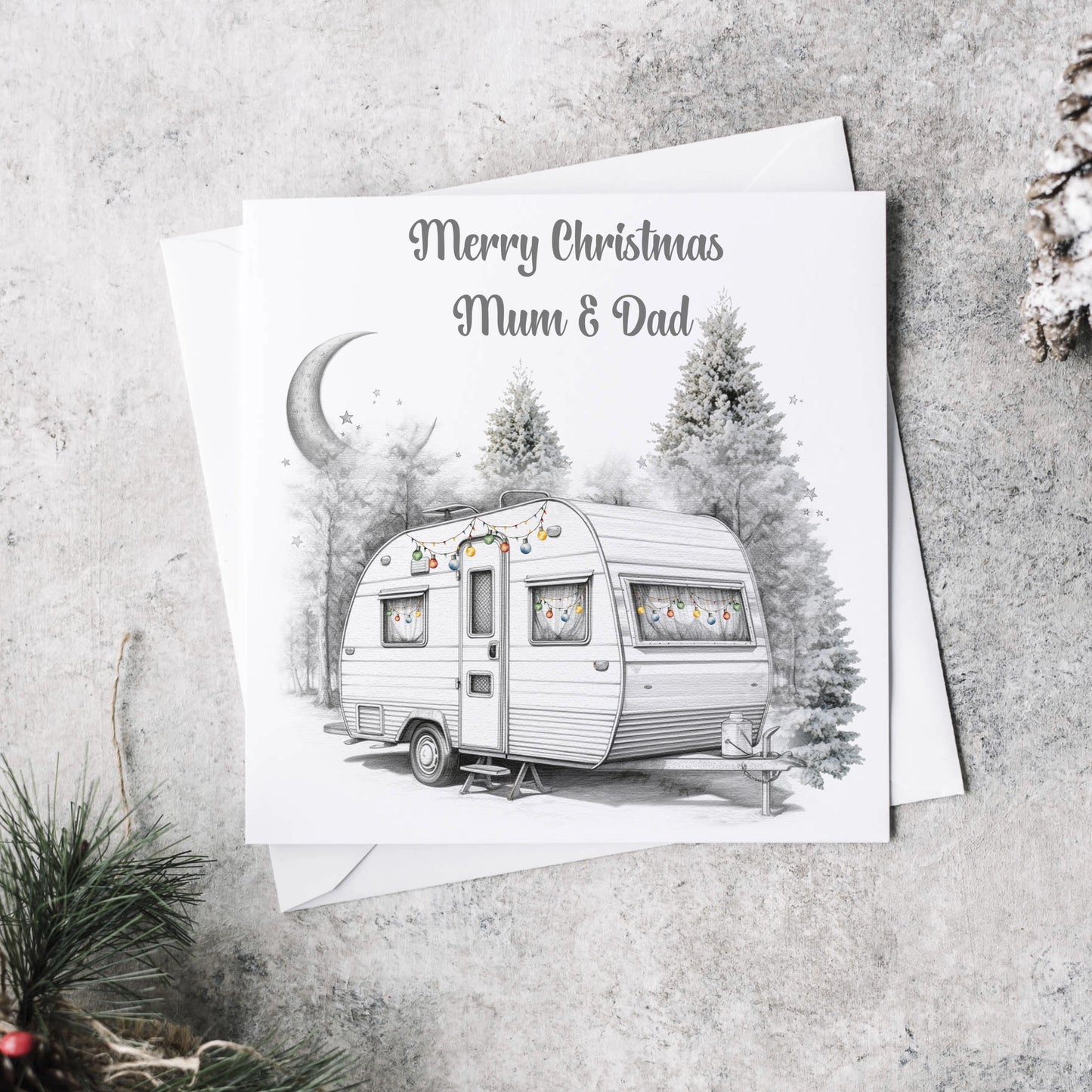 Personalised Christmas card featuring a caravan decorated with baubles and the text Merry Christmas 