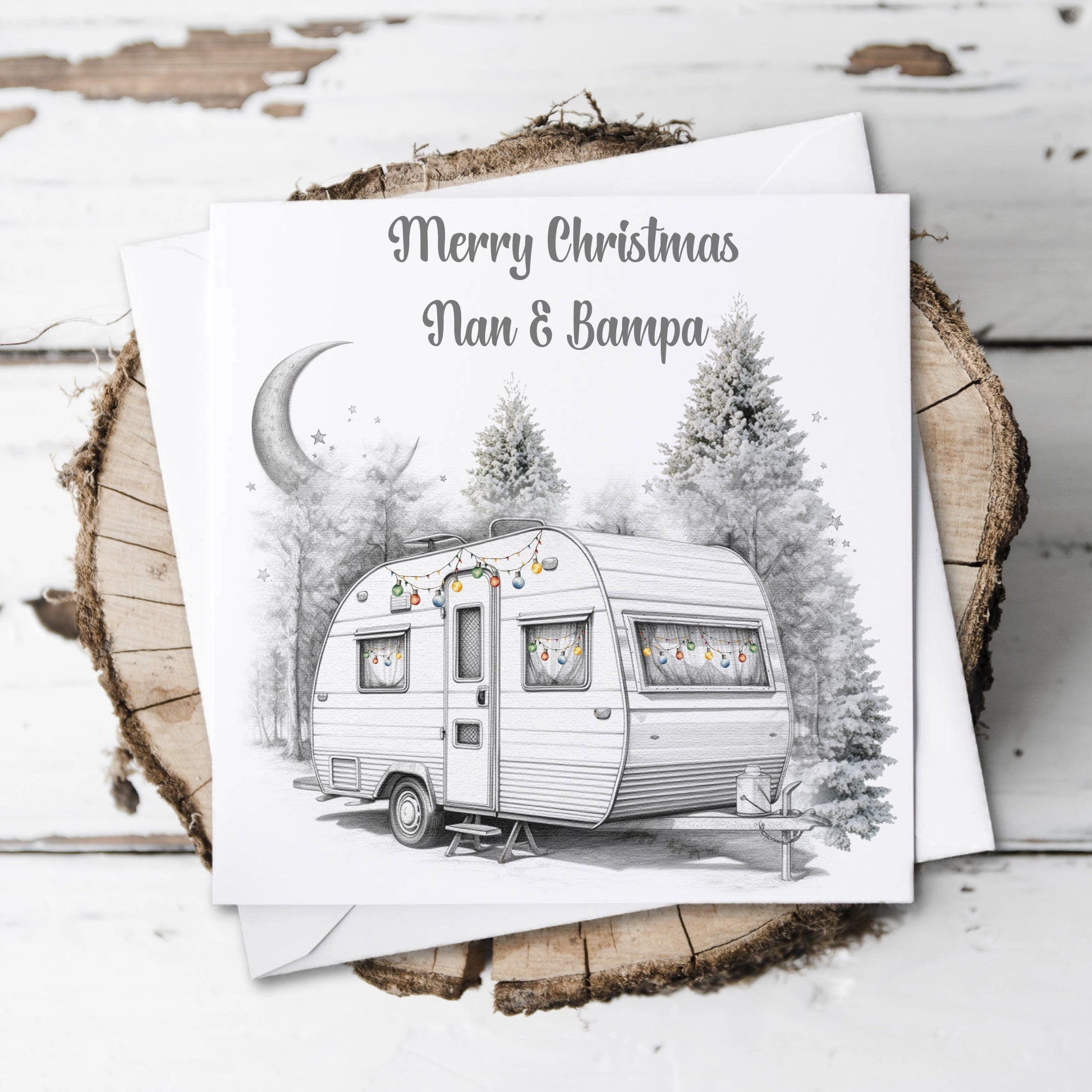 Personalised Christmas card featuring a caravan decorated with baubles and the text Merry Christmas 