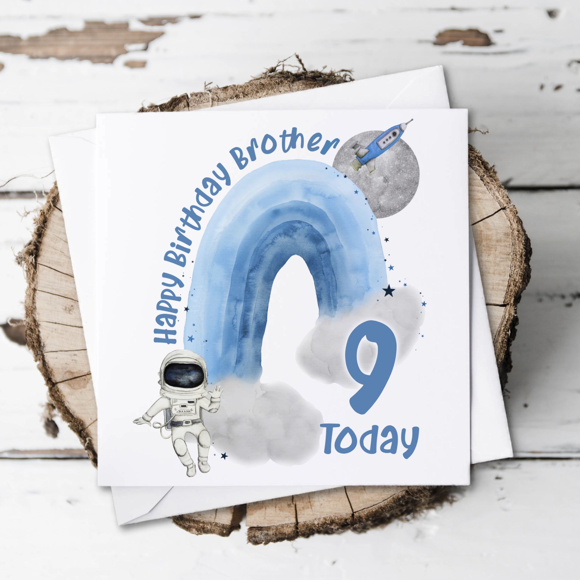 Personalised Birthday card featuring an astronaut, rocket, planet and a rainbow with a name and age