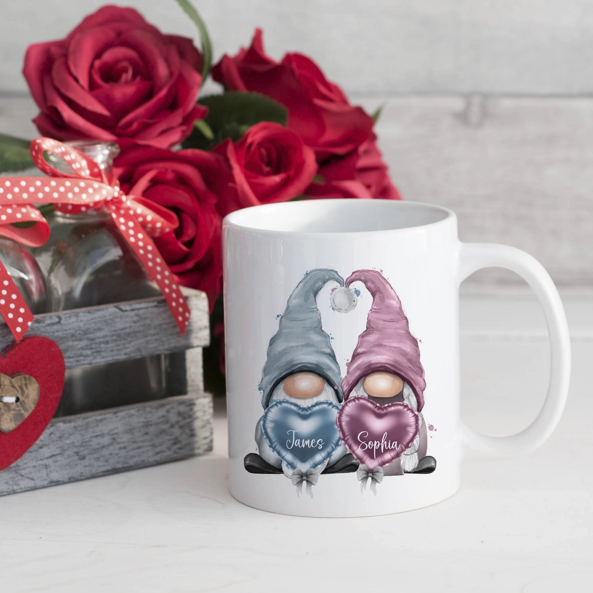 10oz ceramic mug featuring a blue and a pink gonk personalised with names. Perfect for a Valentine's gift or a Wedding gift.