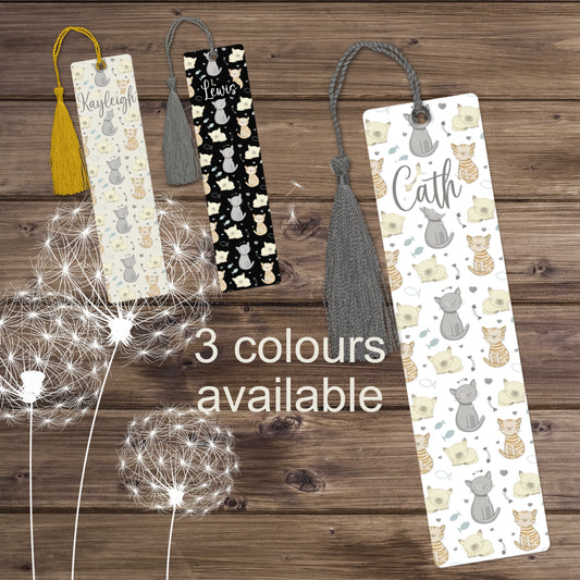 Picture showing 3 personalised aluminium bookmarks with tassels.  All bookmarks have a cat pattern and one has a taupe background, one has a white background and one has a black background.