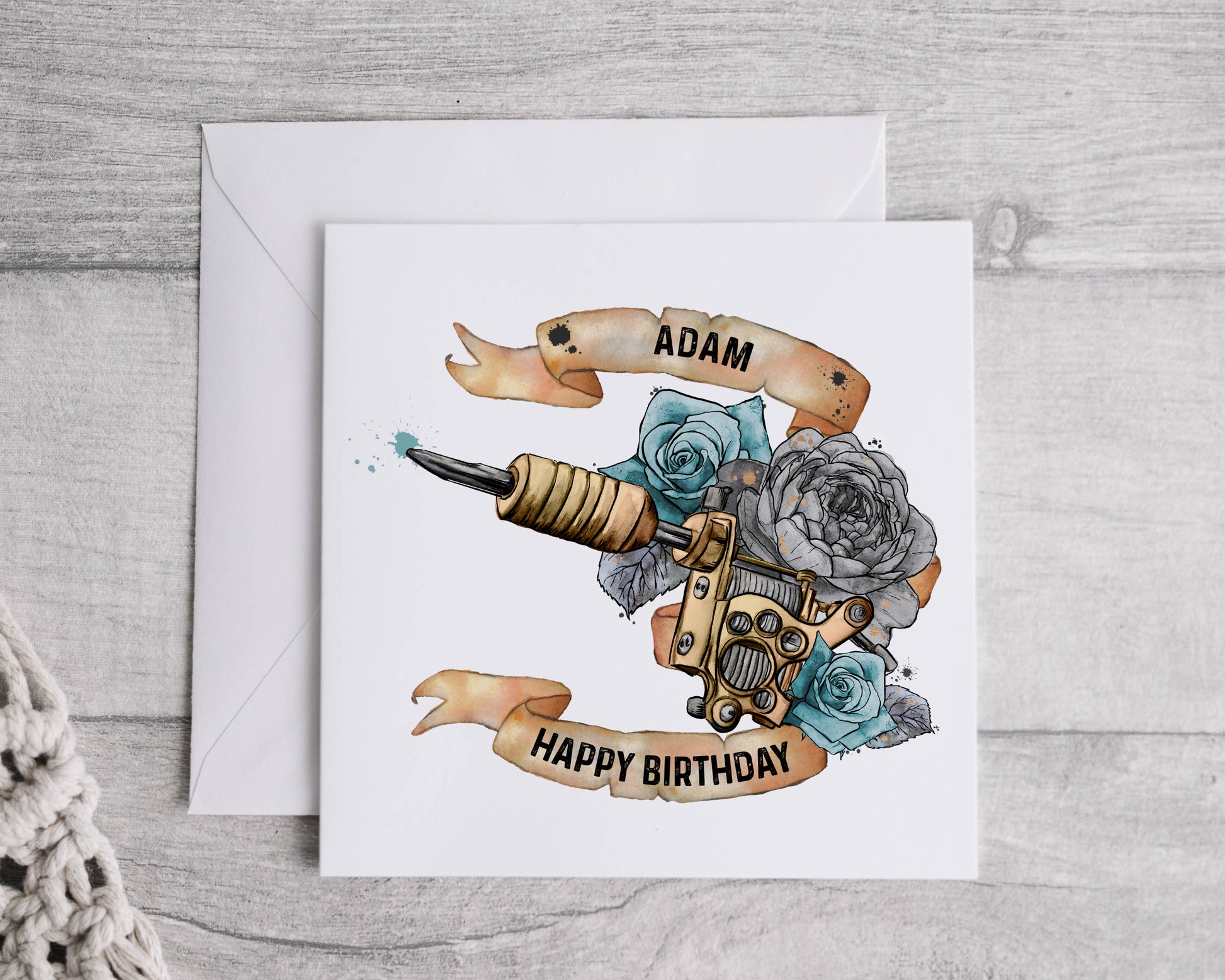 Birthday greeting card that can be personalised featuring a watercolour floral tattoo gun in blue