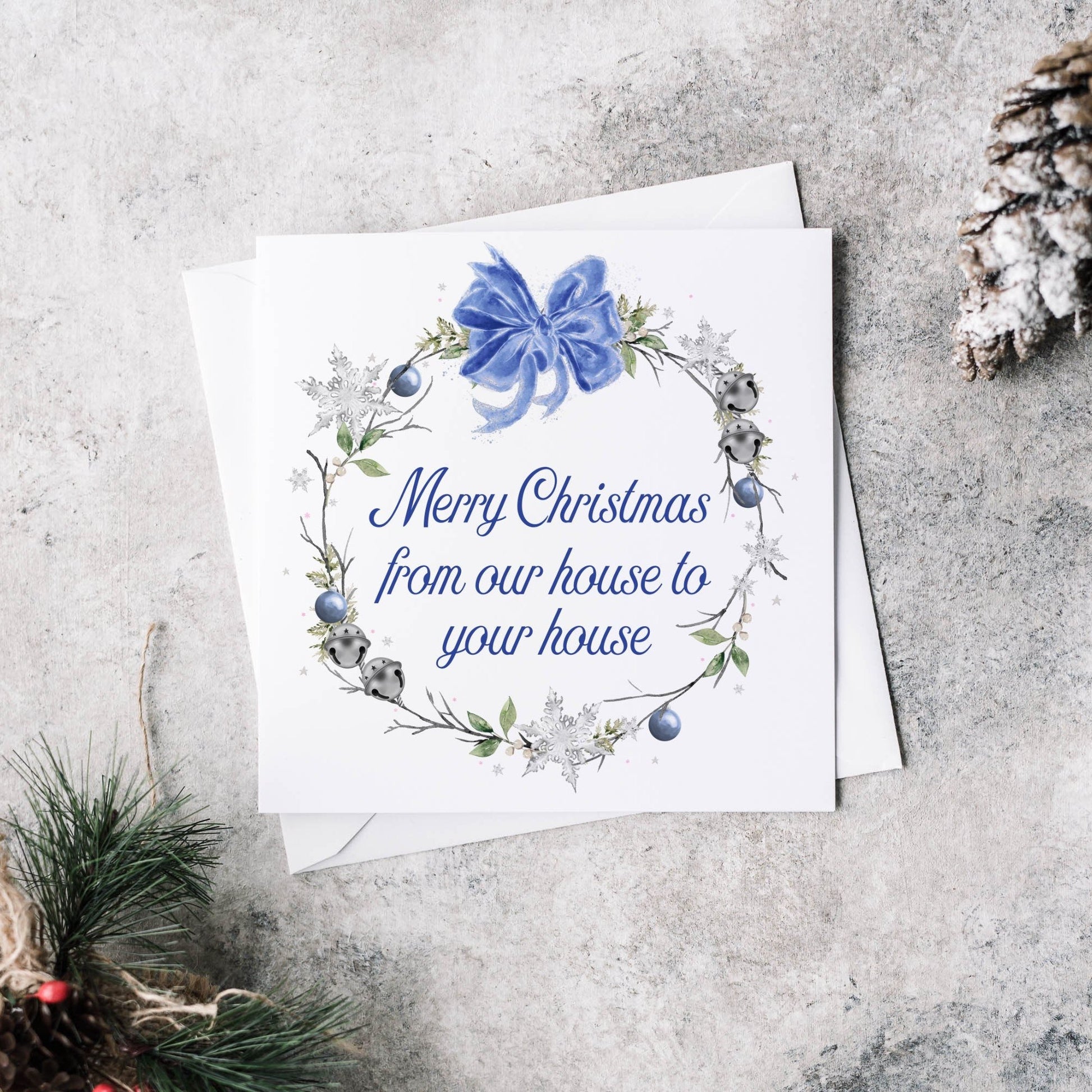 Christmas greeting card featuring a winter blue wreath and personalised text