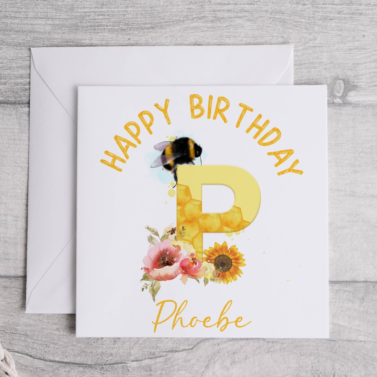 Personalised birthday card with a bumble bee, flowers and the initial letter P