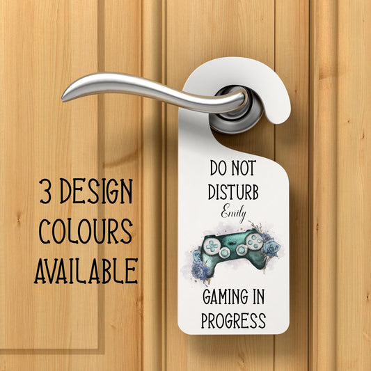 Aluminium door hanger featuring a hand painted floral gaming design and the text 'Do not disturb, gaming in progress' can be personalised. Teal, pink or purple 