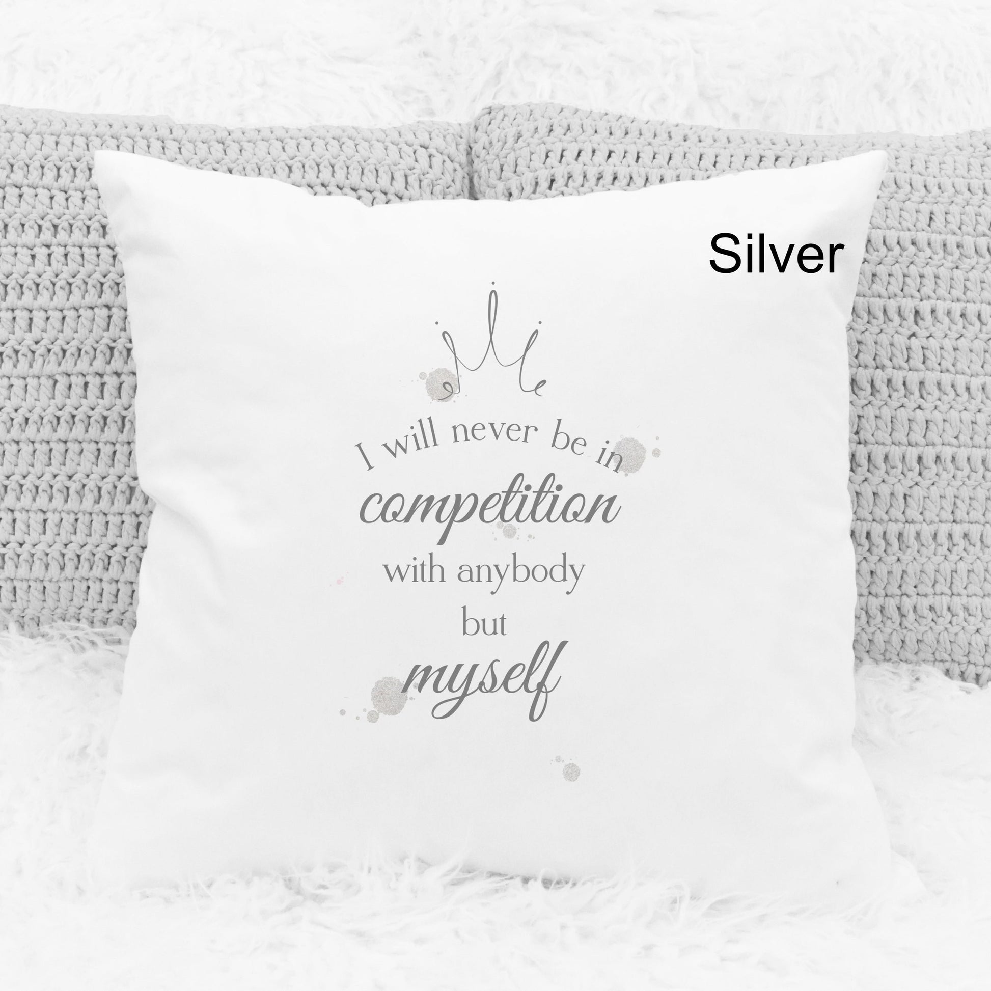 Square cushion featuring silver watercolour splodges and a crown with the text 'I will never be in competition with anybody but myself'