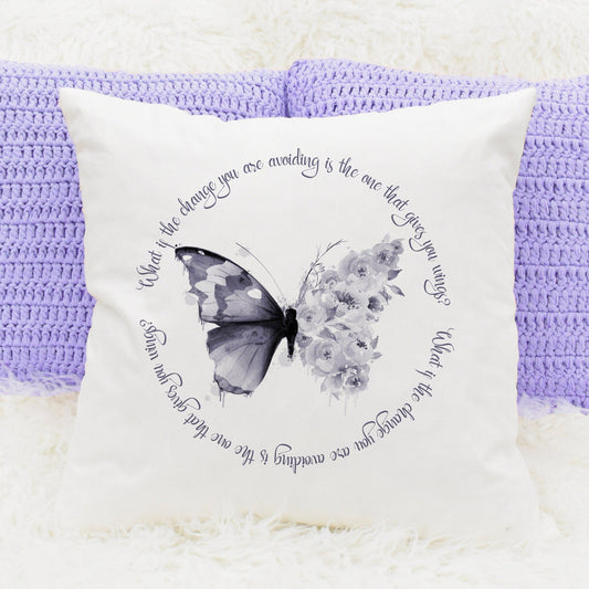 Square cushion with a dark purple floral butterfly with wording in  a circle reading 'What if the change you are avoiding is the one that gives you wings?'