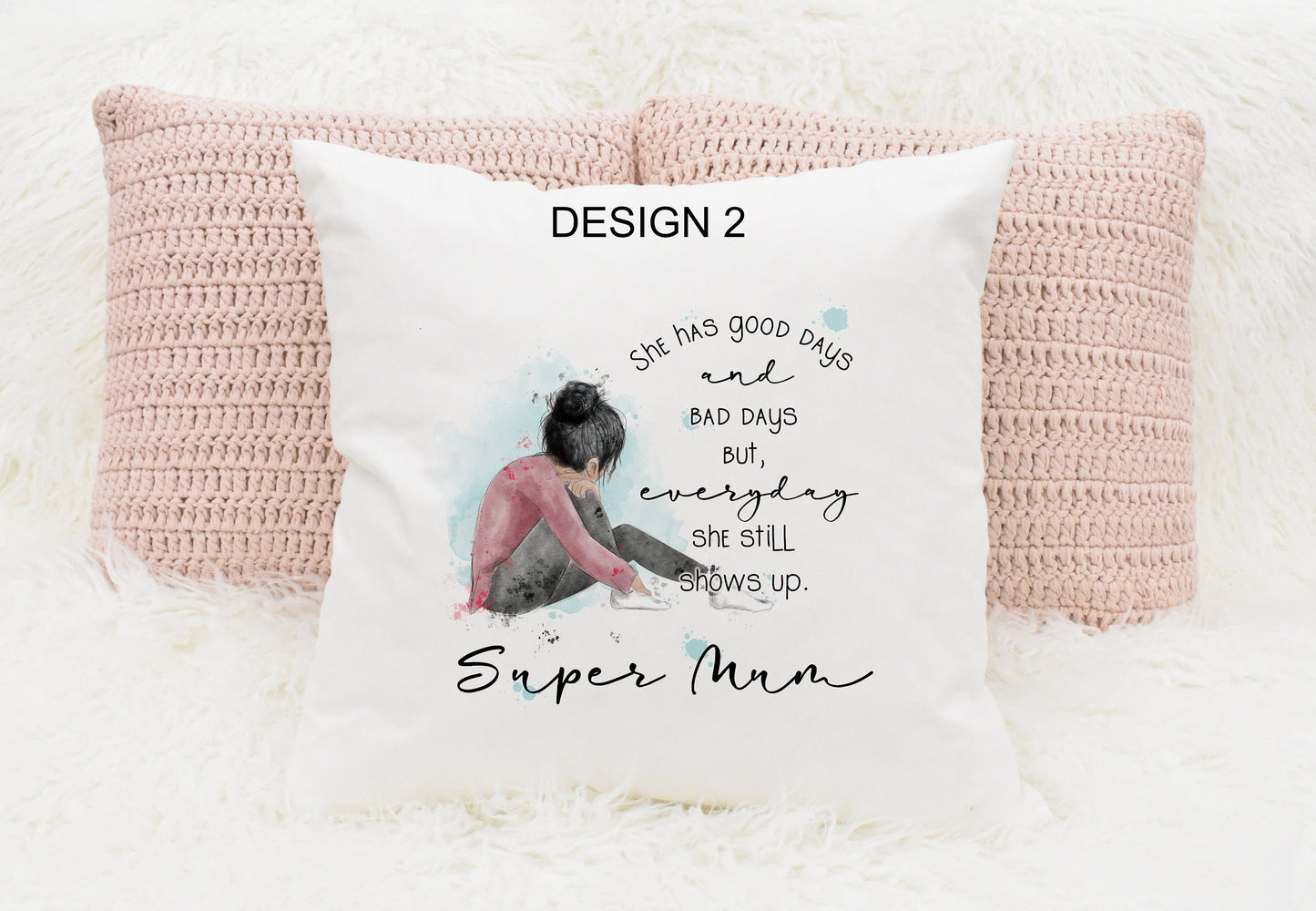 Square cushion featuring a watercolour design of a girl sitting down. Text reads 'She has good days and bad days but everyday she still shows up. Can be personalised.