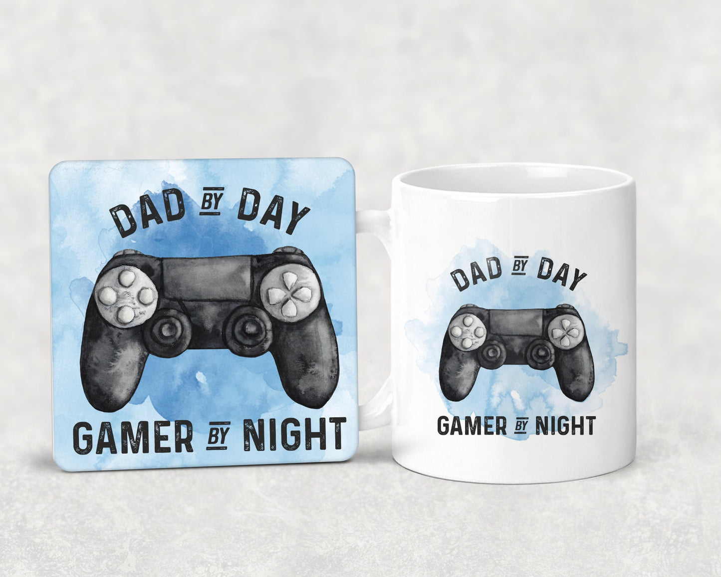Mug and coaster set featuring a gaming design with text that reads 'dad by day, gamer by night' in blue