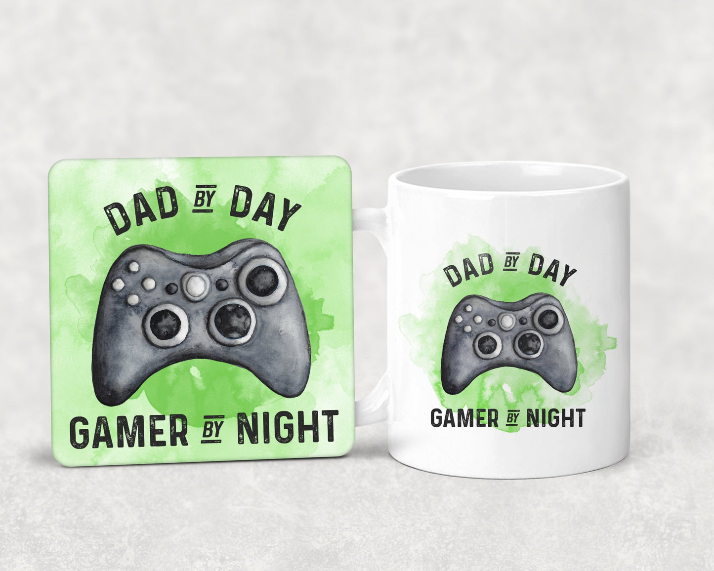 Mug and coaster set featuring a gaming design with text that reads 'dad by day, gamer by night' in green