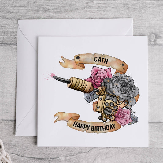 Birthday greeting card that can be personalised featuring a watercolour floral tattoo gun in pink