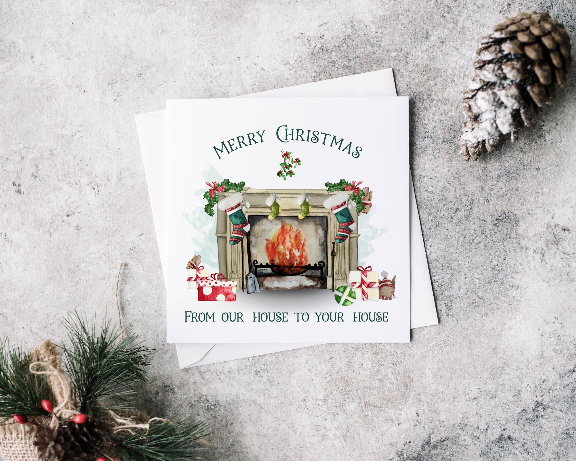 Personalised Christmas greeting card featuring a traditional fireplace, green and red stockings, cute mice and gifts