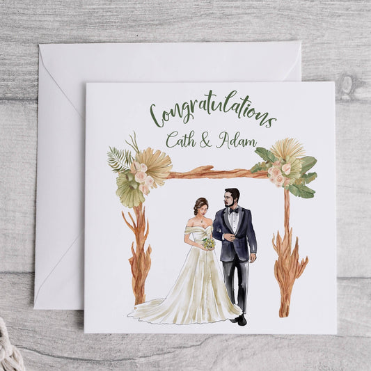Wedding congratulations card featuring a bride and groom under a boho arch and personalised text