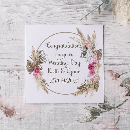 Wedding congratulations greeting card featuring a boho floral wreath, text can be personalised