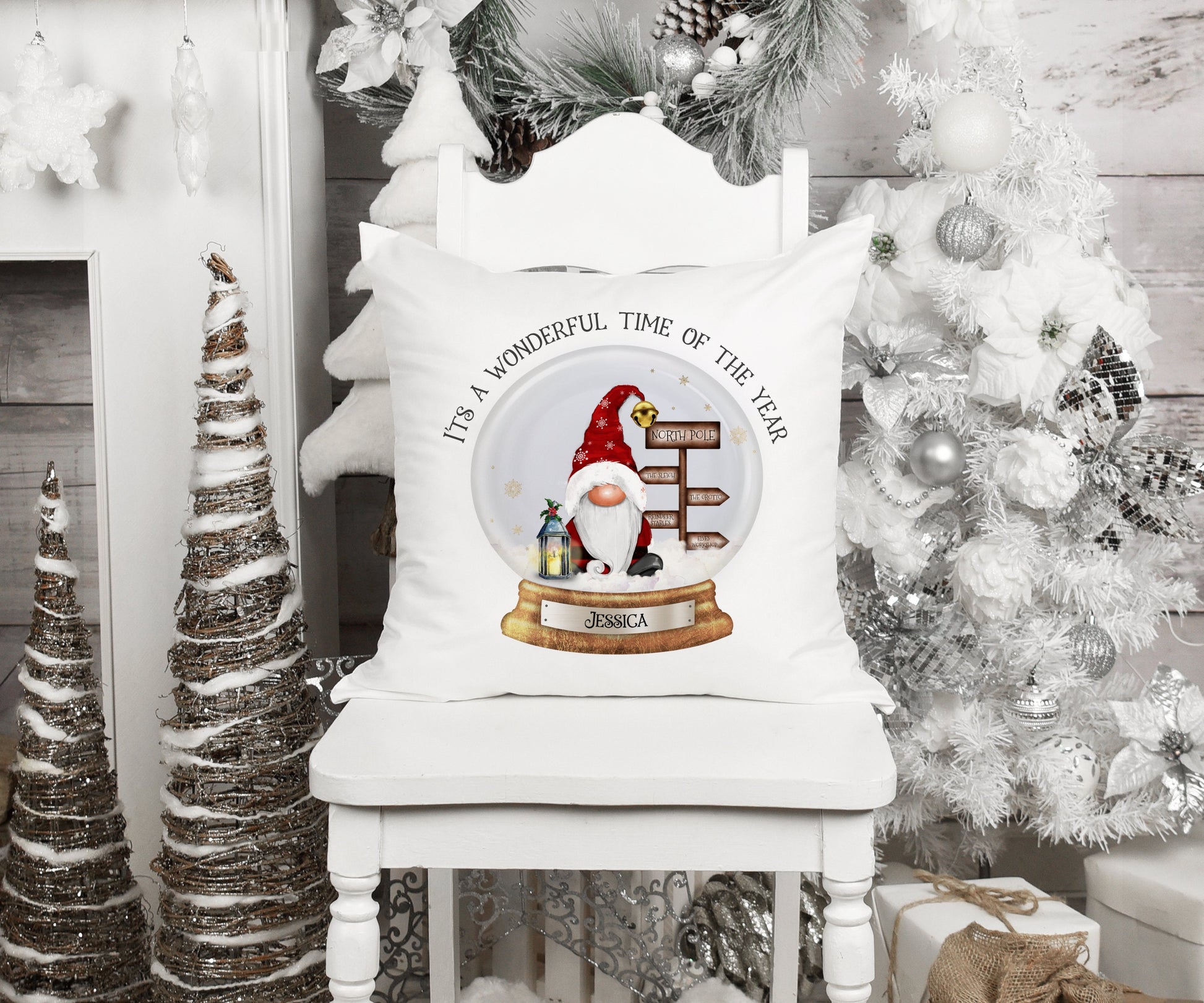 Square cushion featuring a santa with a sign post and a lantern in a snowglobe. The text reads 'It's a wonderful time of the year' Can be personalised