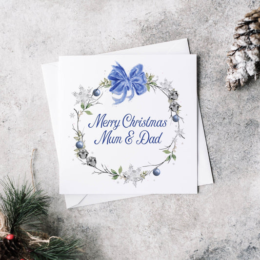 Christmas greeting card featuring a winter blue wreath and personalised text