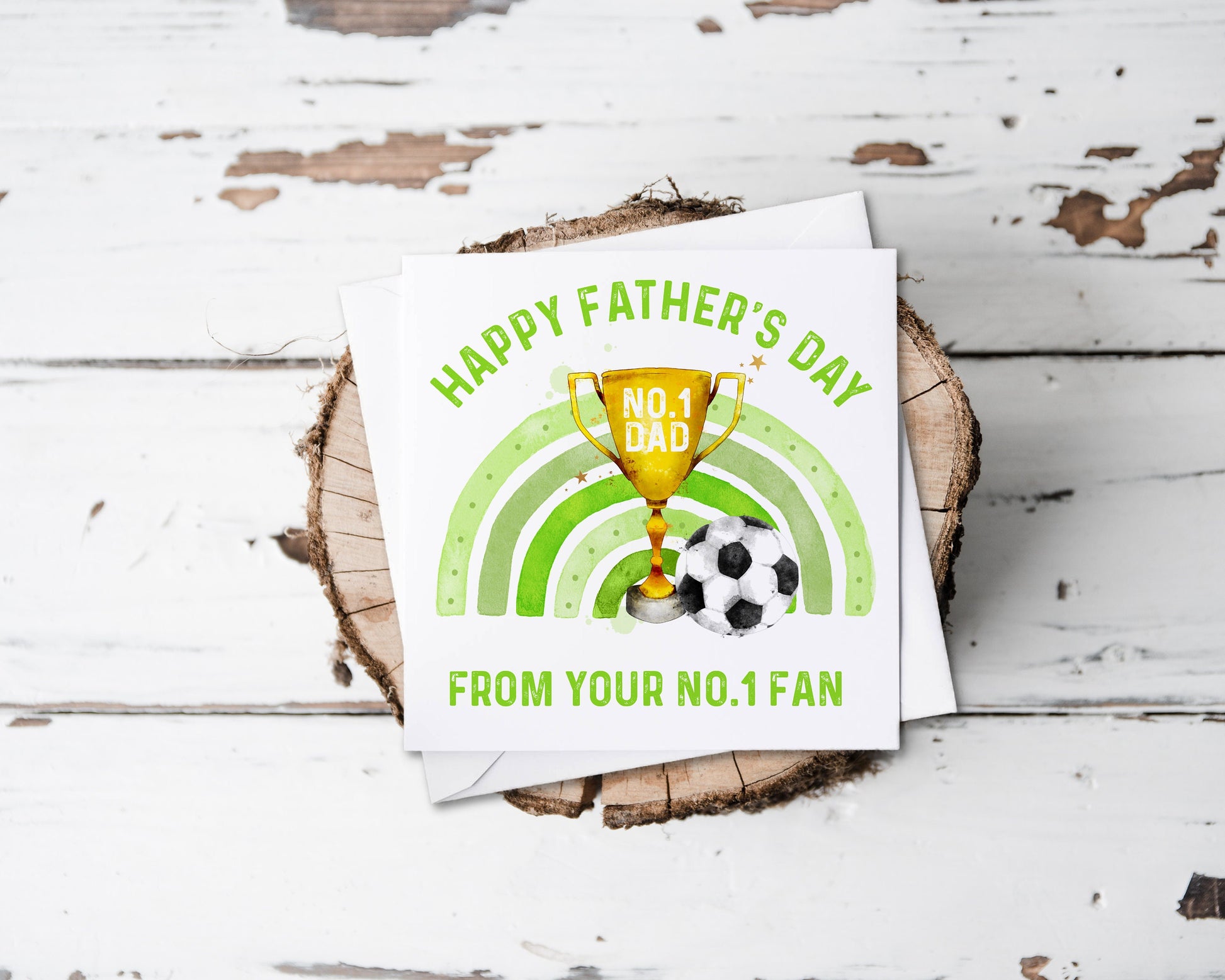 Father's day greeting card, the design features a trophy, a green rainbow and a football, text reads 'Happy Father's Day from your no.1 fan'
