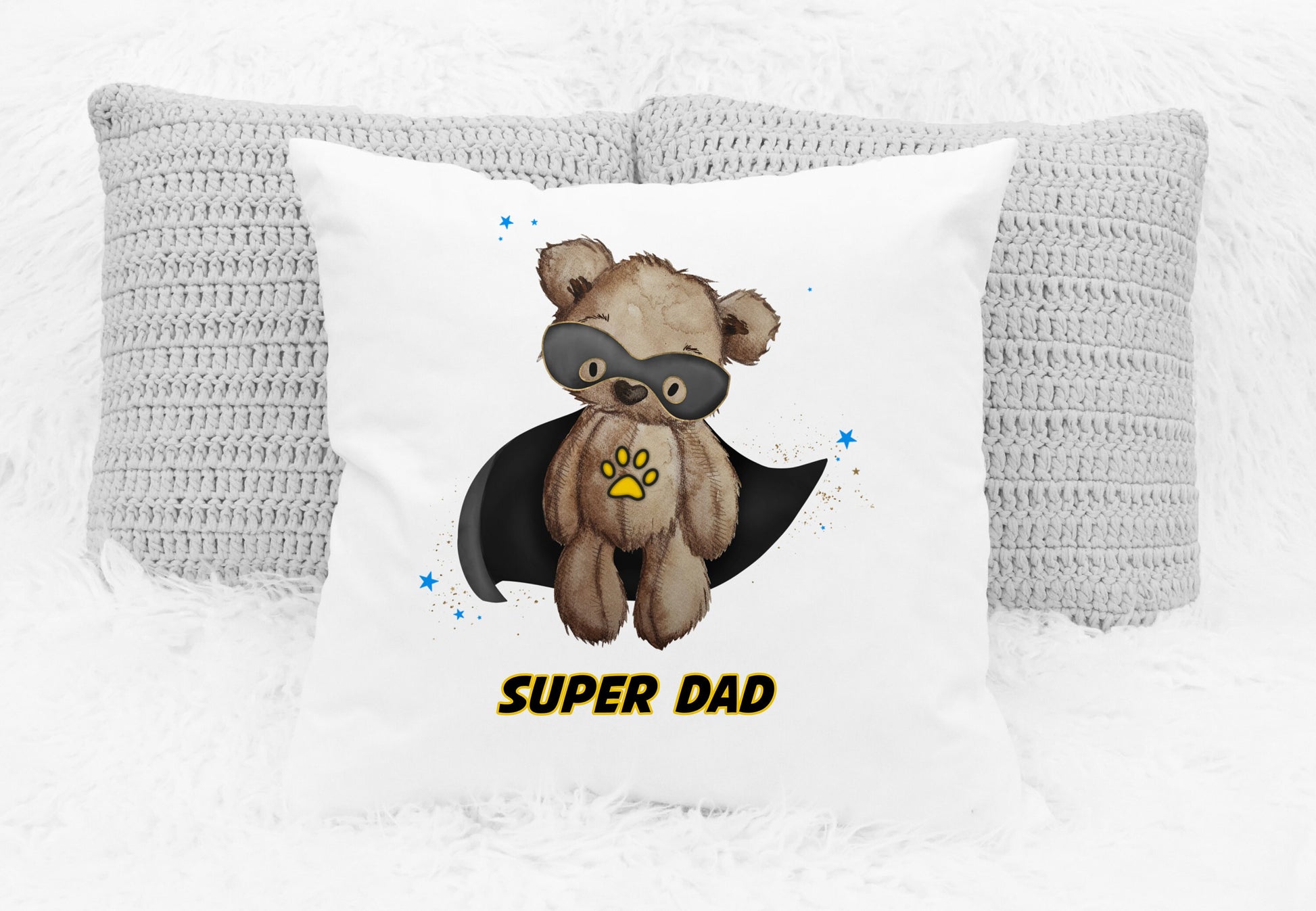 Square cushion featuring a teddy bear wearing a black cape and a black eye mask design. The text reads 'Super dad'