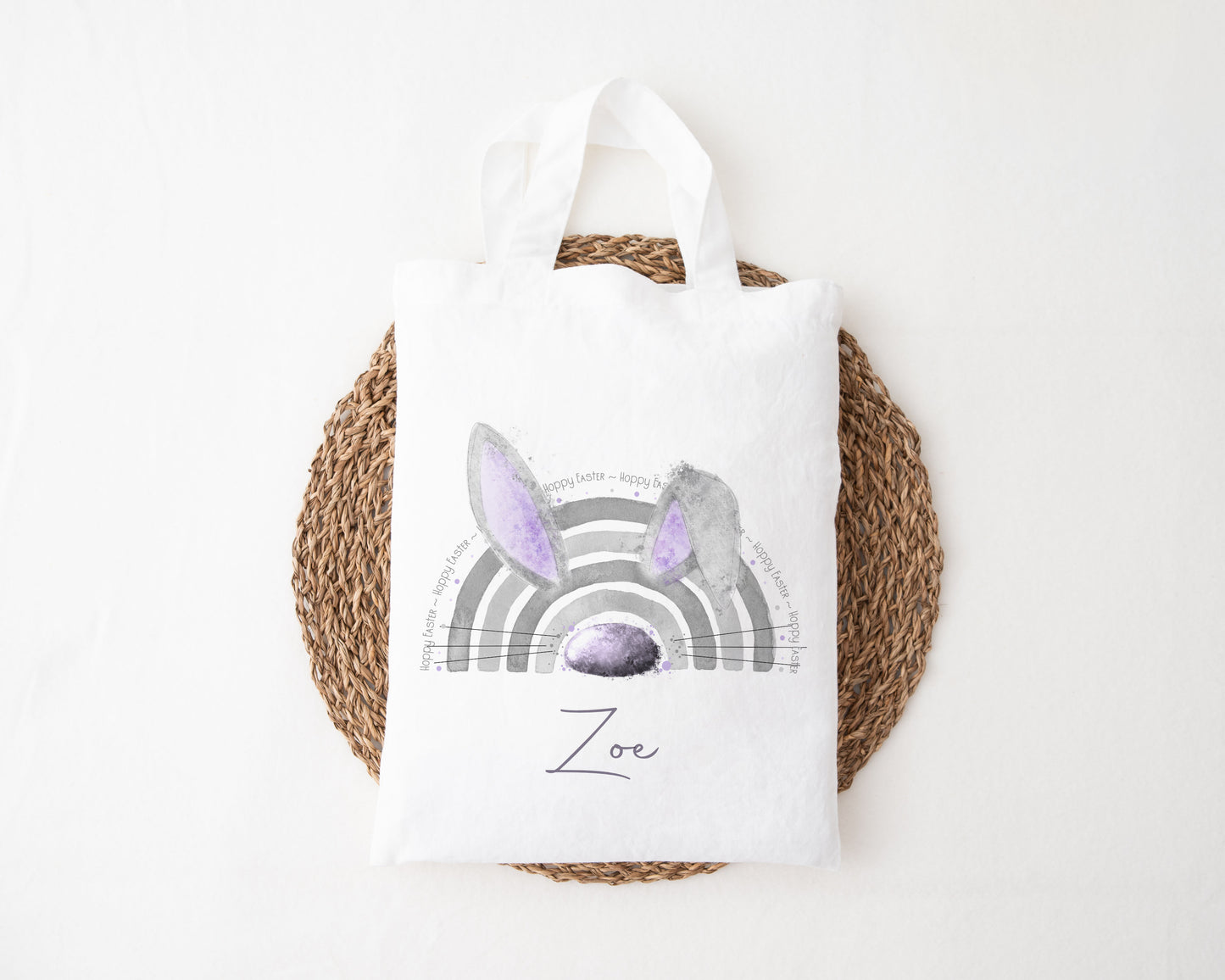 A mini tote bag featuring a personalised lilac rainbow bunny ear design.