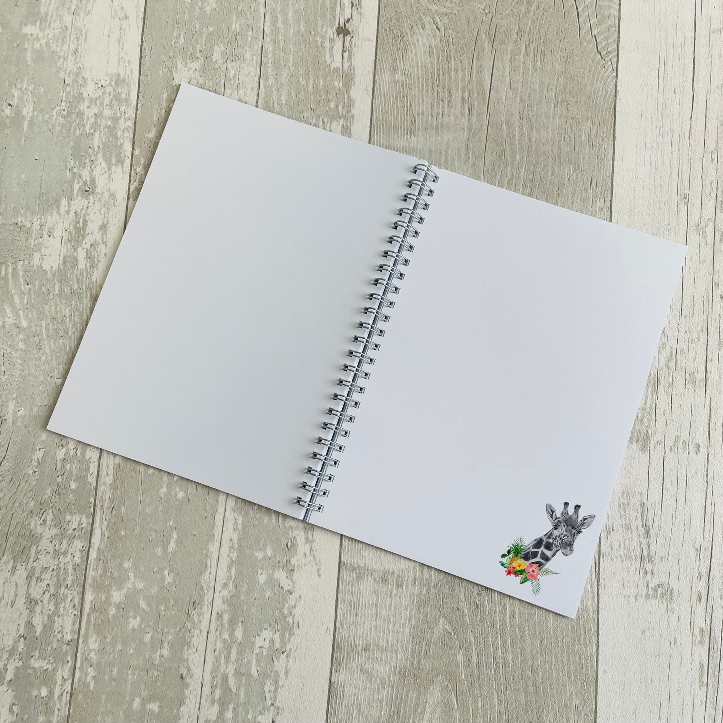 personalised notebook featuring a giraffe in flowers