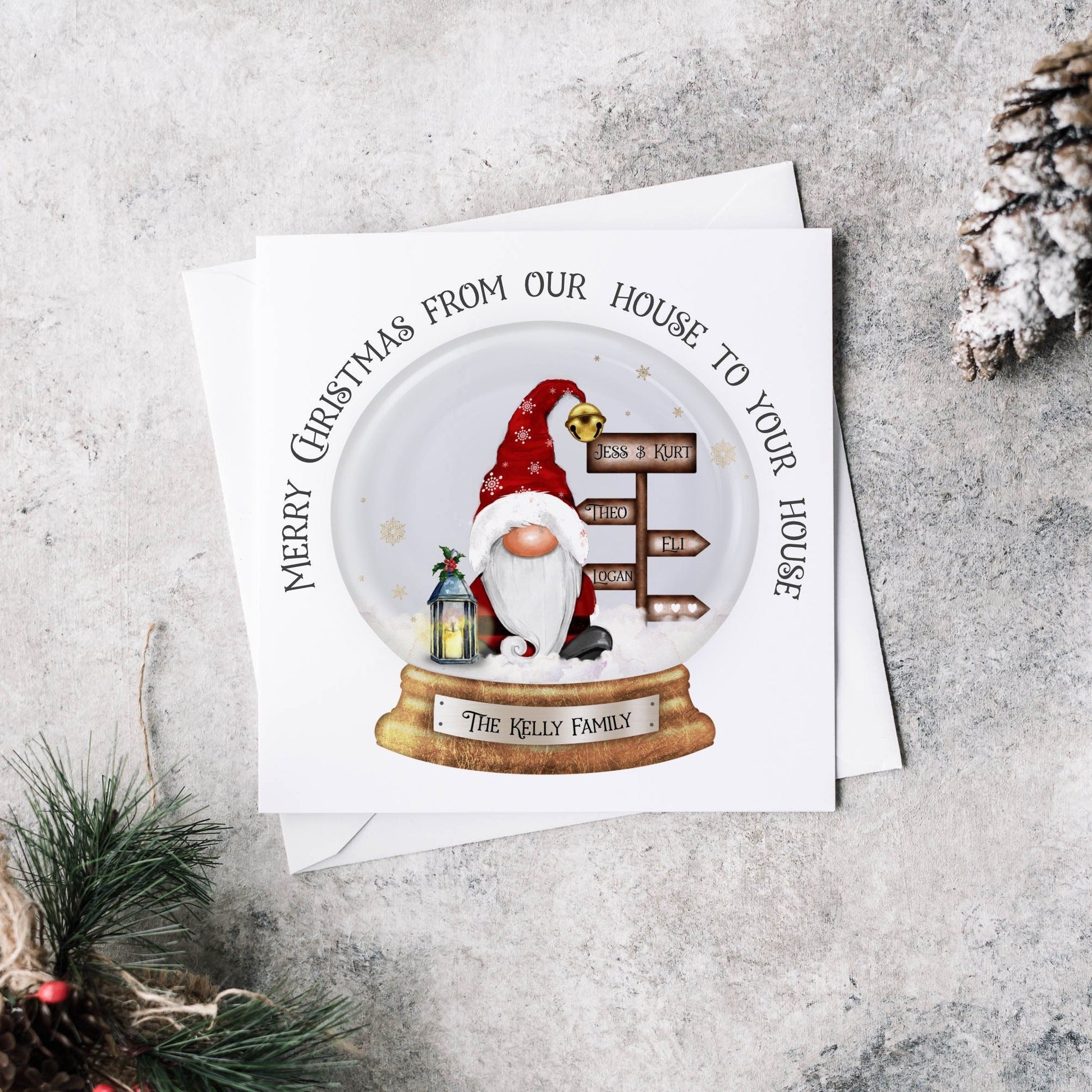 Christmas greeting card featuring Santa with a signpost and a lantern within a snowglobe, text can be personalised